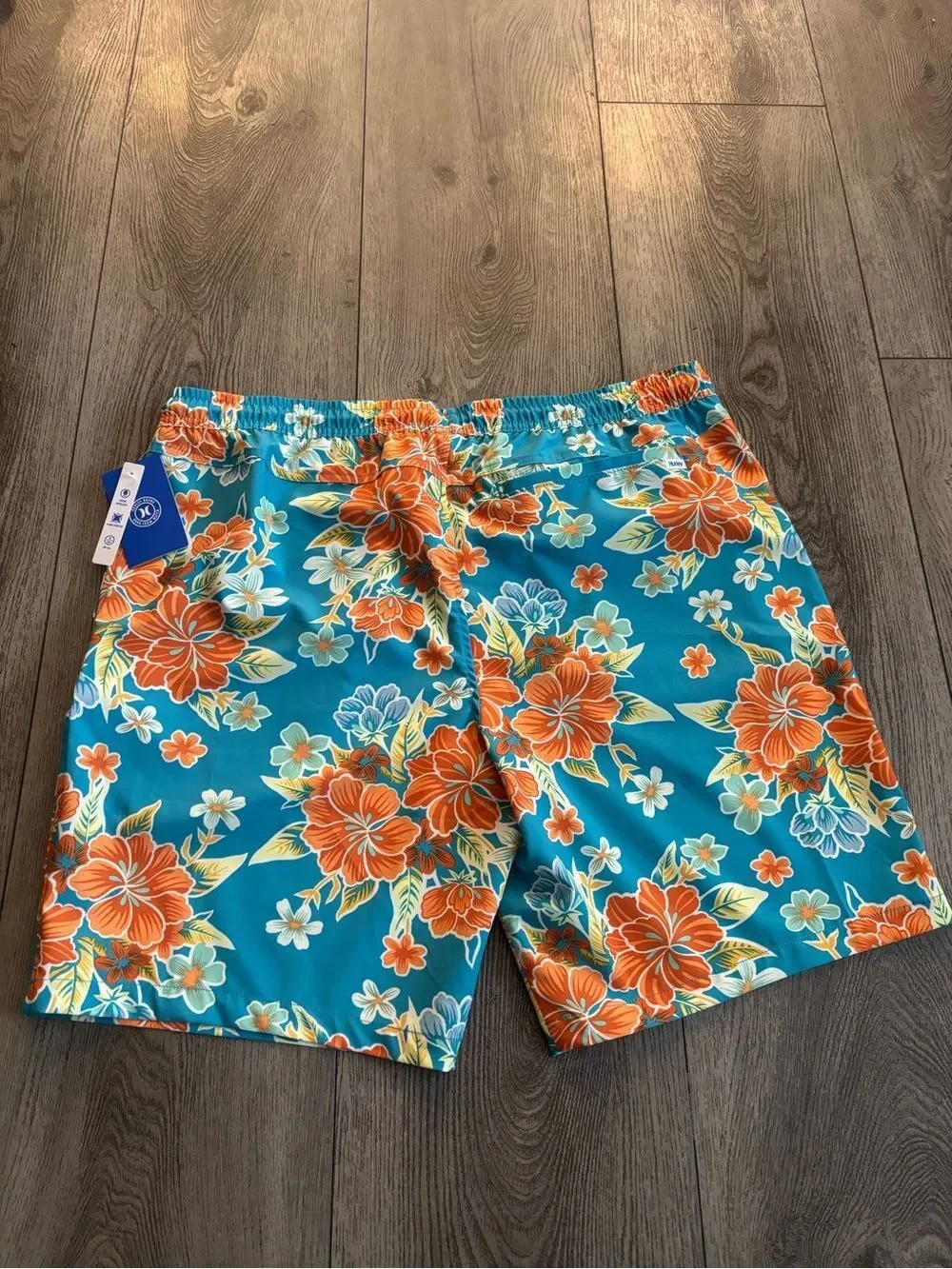 Hurley men’s  Teal Floral Swim Trunks - Vibrant Orange Hibiscus